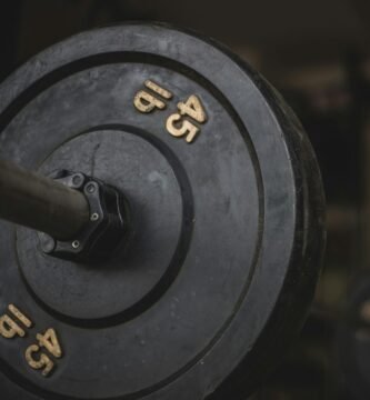 black and gray dumbbell on black surface