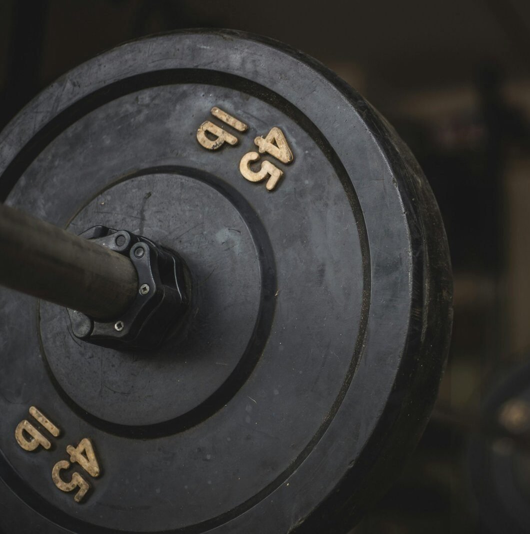 black and gray dumbbell on black surface